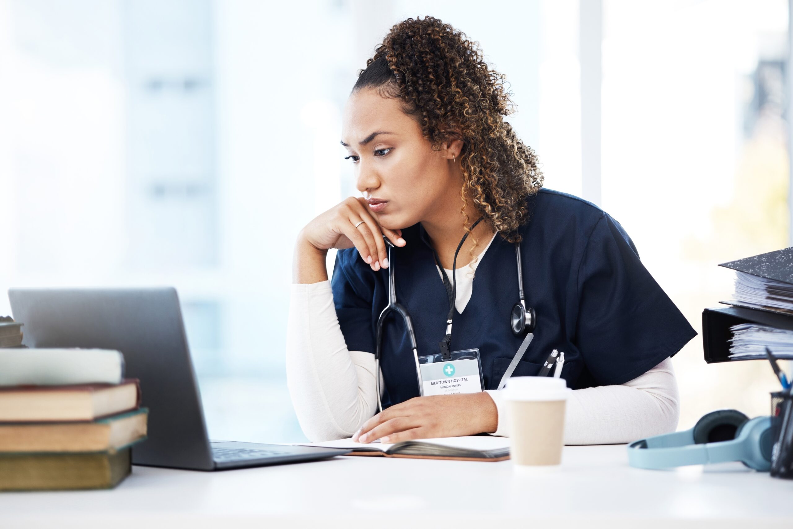 Nursing student looking at a laptop